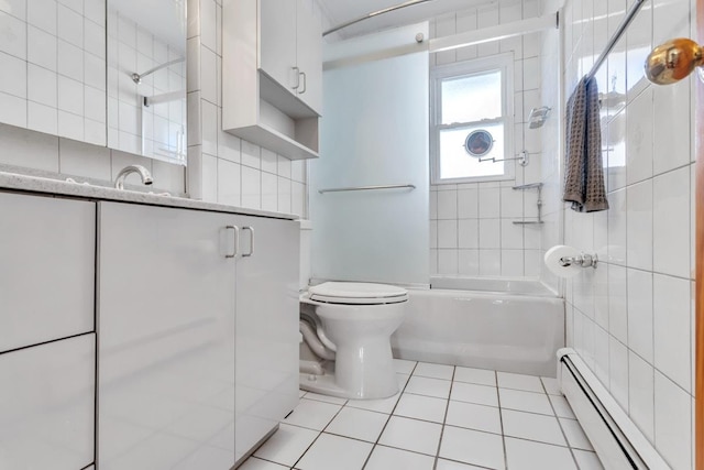 bathroom featuring a baseboard radiator, tile patterned floors, tile walls, toilet, and shower / bath combination with glass door