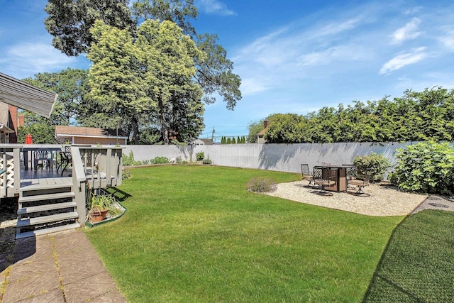 view of yard featuring a wooden deck