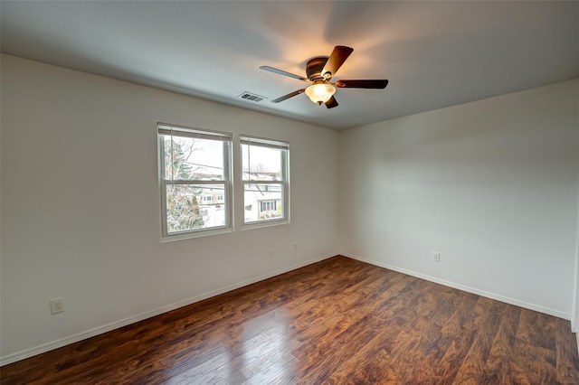 unfurnished room featuring ceiling fan and dark hardwood / wood-style flooring