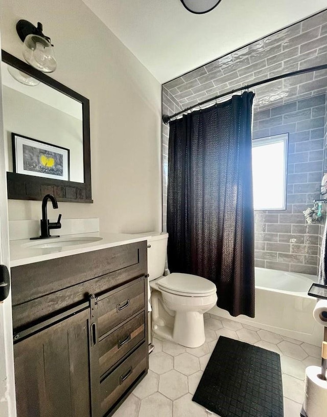 full bathroom with toilet, tile patterned floors, shower / bath combo, and vanity