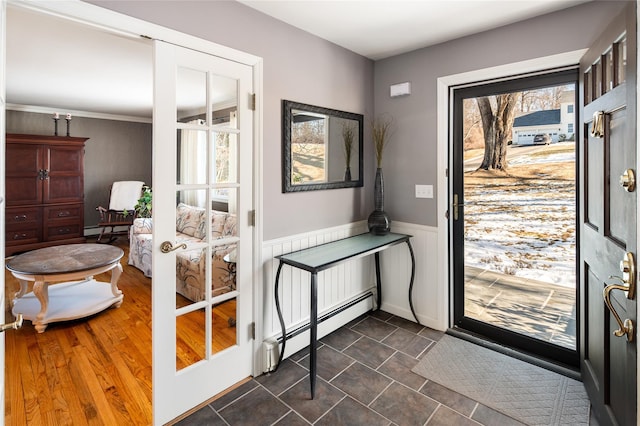 doorway with a healthy amount of sunlight and baseboard heating