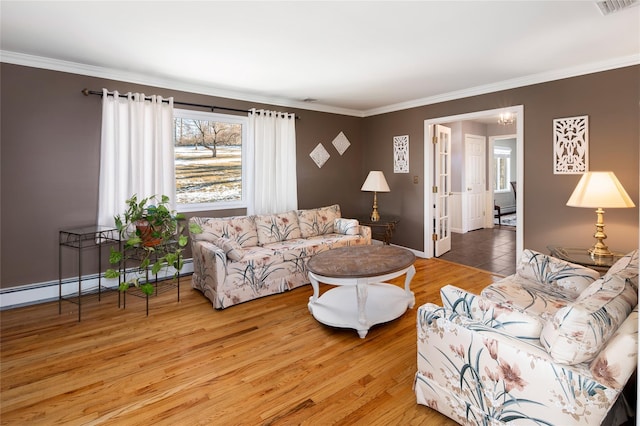 living room featuring wood-type flooring and ornamental molding