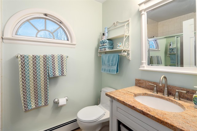 bathroom featuring vanity, a shower with shower door, a baseboard heating unit, and toilet