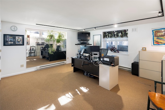 carpeted office featuring a baseboard radiator and track lighting