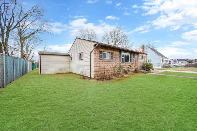 view of side of property with a yard