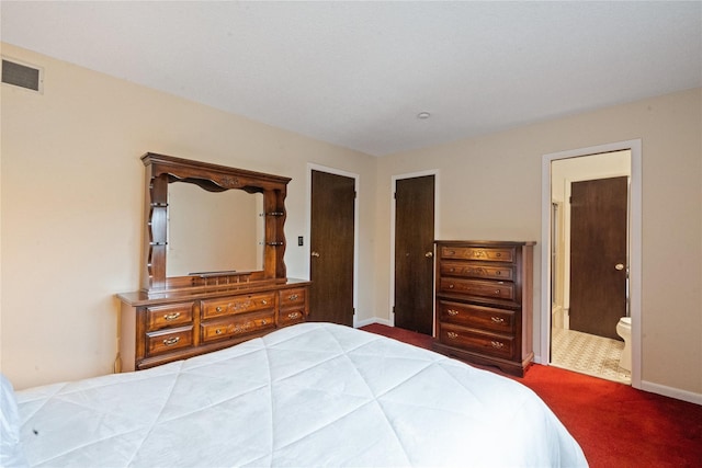 carpeted bedroom with connected bathroom