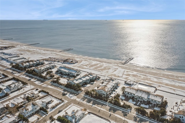 birds eye view of property featuring a water view and a view of the beach