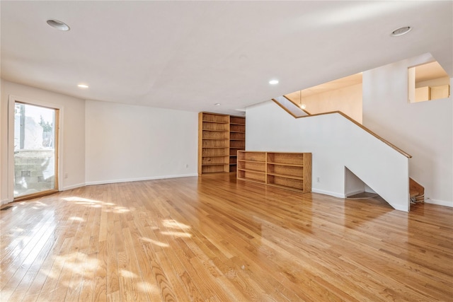 unfurnished living room with hardwood / wood-style flooring