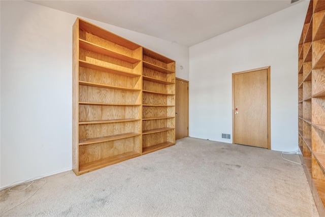 interior space featuring light carpet