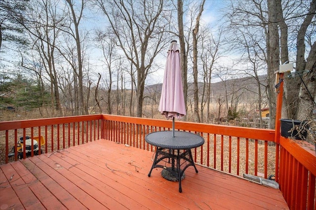 wooden deck with a mountain view