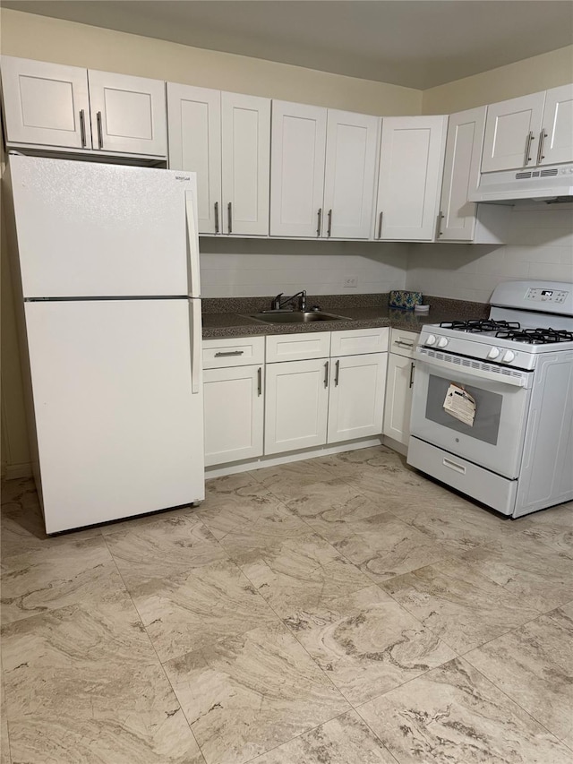 kitchen featuring white appliances, white cabinets, and sink