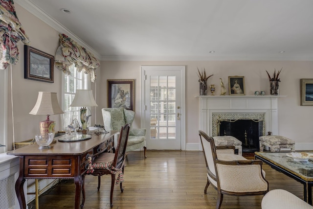 interior space with hardwood / wood-style floors and crown molding