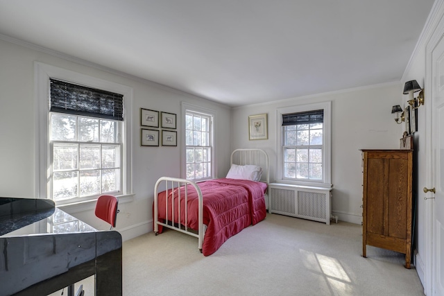 carpeted bedroom with radiator and ornamental molding