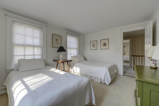 carpeted bedroom featuring ornamental molding