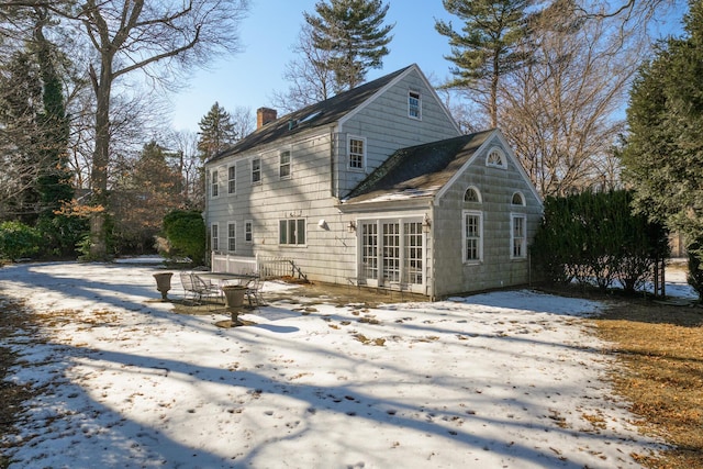 view of snow covered house