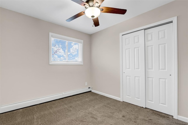 unfurnished bedroom featuring a closet, ceiling fan, baseboard heating, and light carpet