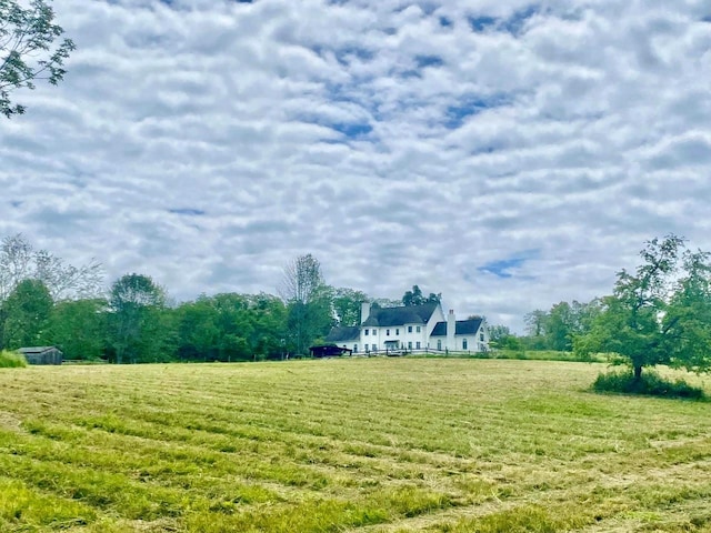 view of yard with a rural view