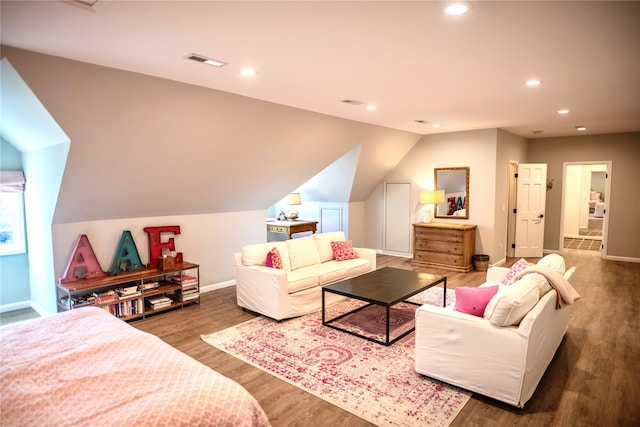 living room with dark hardwood / wood-style flooring and lofted ceiling