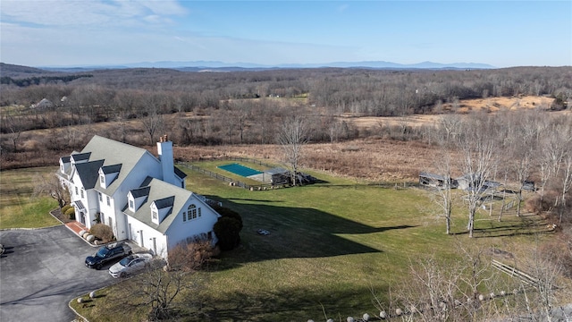 birds eye view of property featuring a mountain view