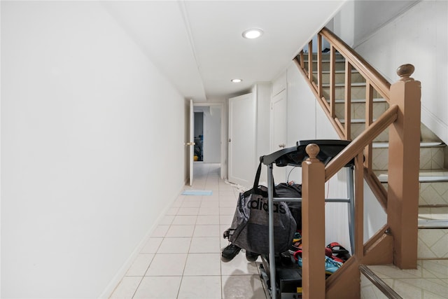 stairway with tile patterned flooring