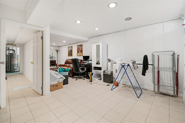 interior space with water heater and light tile patterned floors