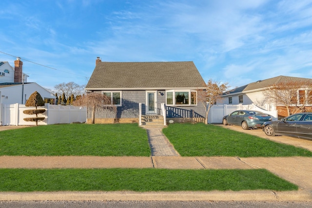 bungalow-style house with a front lawn