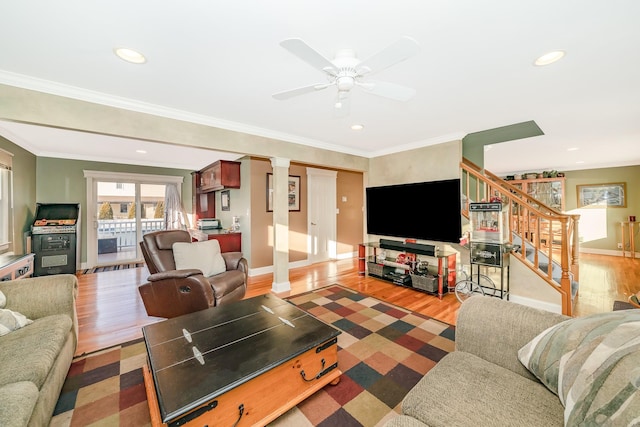 living room with crown molding, hardwood / wood-style flooring, and ceiling fan