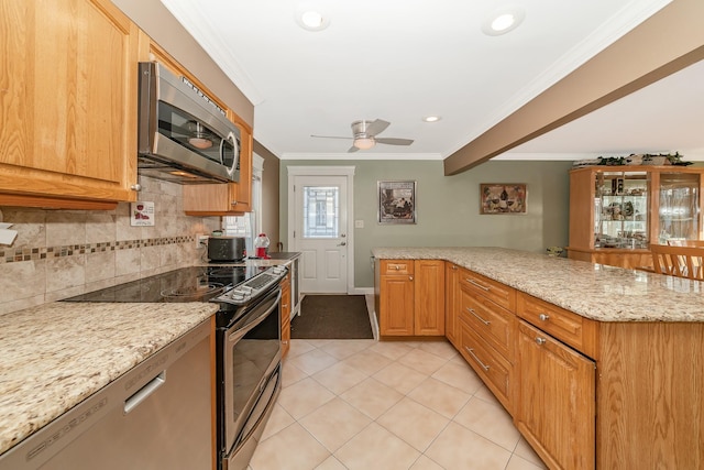 kitchen with backsplash, stainless steel appliances, light stone counters, ornamental molding, and kitchen peninsula