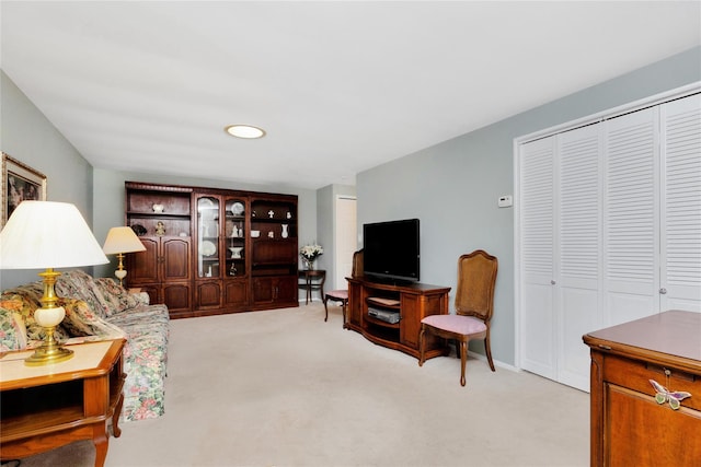 living room featuring light carpet