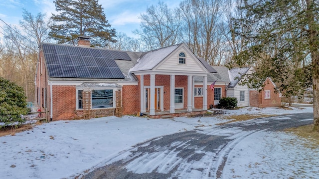 view of front of property with solar panels