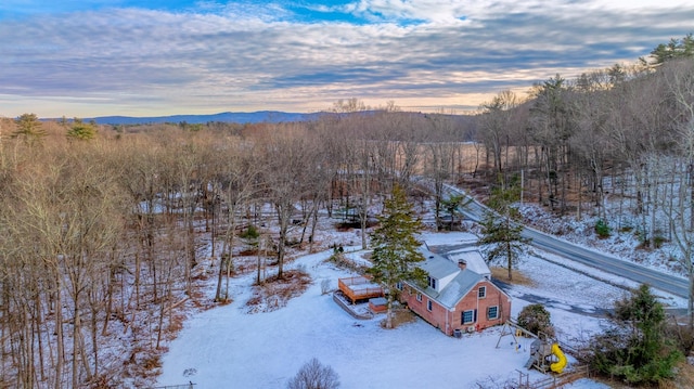 snowy aerial view with a mountain view