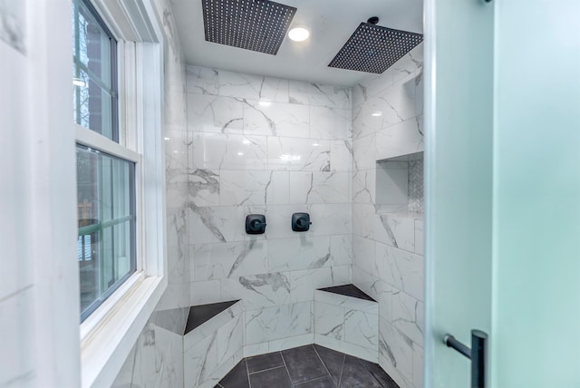 bathroom with a tile shower