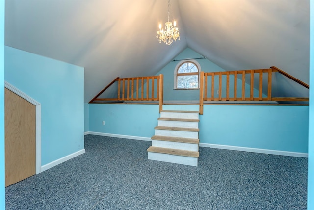 interior space featuring vaulted ceiling, a chandelier, and carpet floors