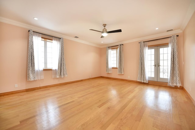 spare room featuring ornamental molding, ceiling fan, light hardwood / wood-style floors, and french doors