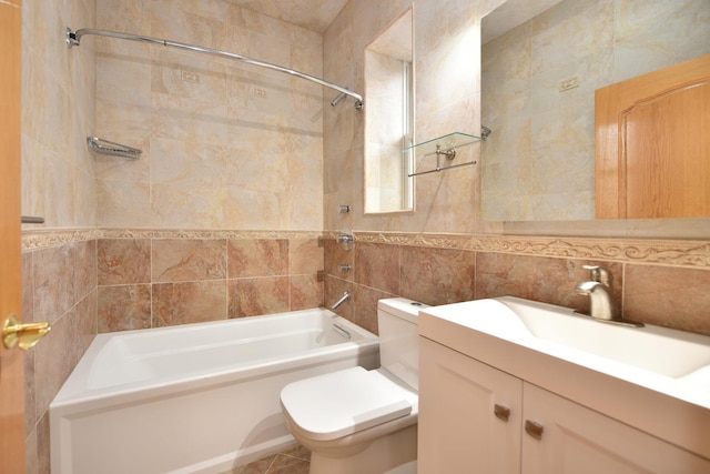 full bathroom with toilet, tiled shower / bath, tile walls, vanity, and decorative backsplash