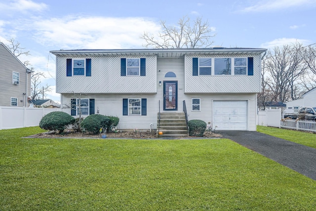 bi-level home with a front lawn and a garage