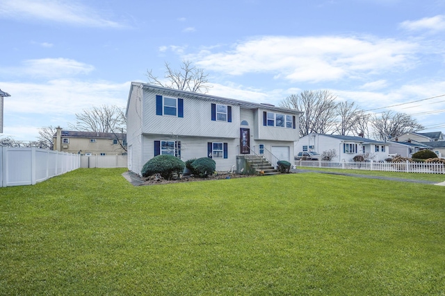 view of front of property with a front lawn and a garage