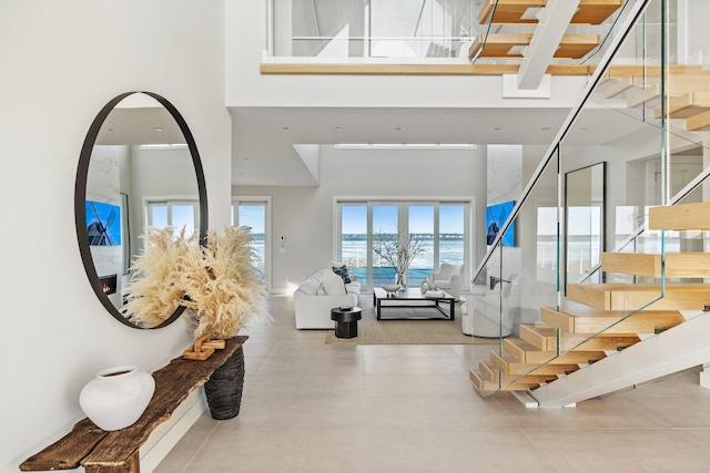 foyer with a towering ceiling