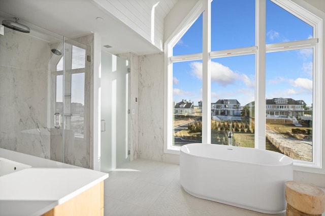 bathroom featuring separate shower and tub