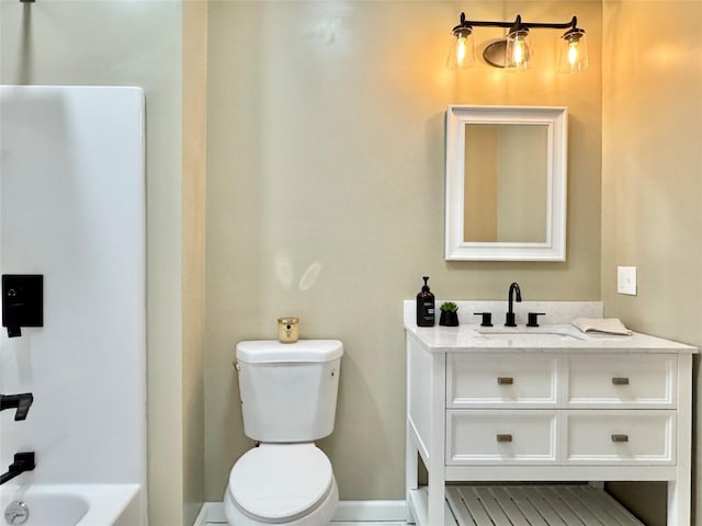 full bathroom with tub / shower combination, toilet, and vanity