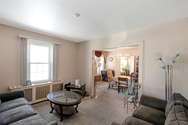 living room featuring light carpet, radiator heating unit, and an inviting chandelier