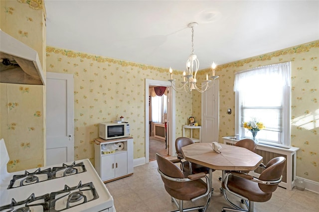 dining space featuring a notable chandelier