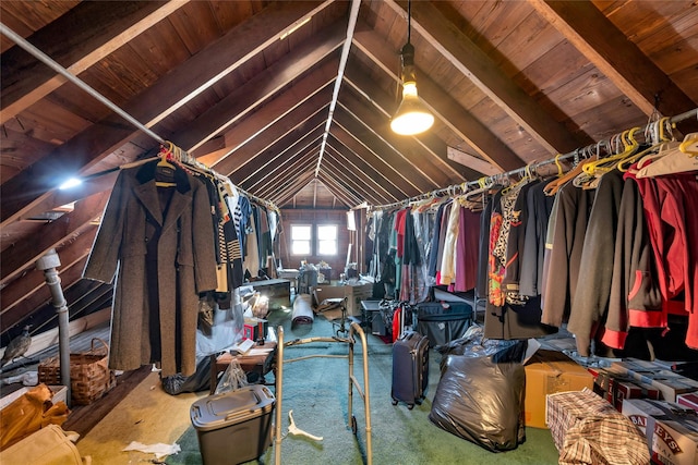 spacious closet featuring vaulted ceiling with beams