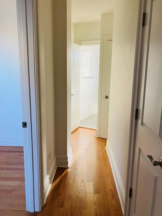 hallway with light wood-type flooring