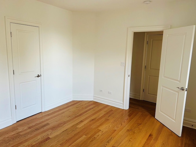 spare room featuring light hardwood / wood-style flooring