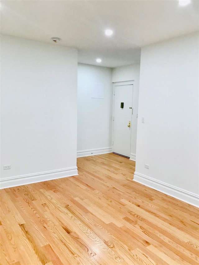 spare room featuring light hardwood / wood-style floors