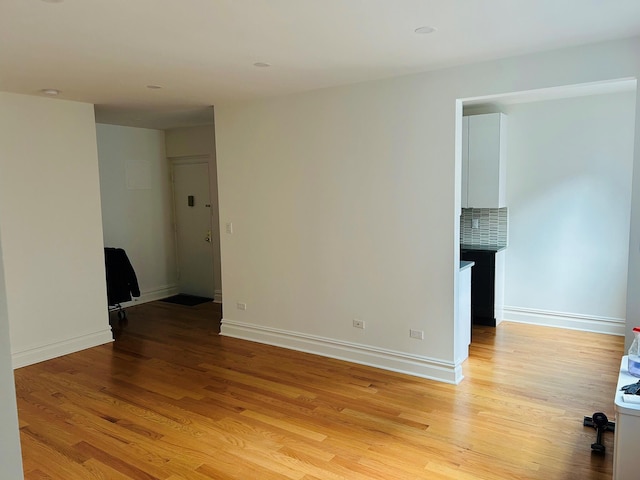 unfurnished room with light hardwood / wood-style floors