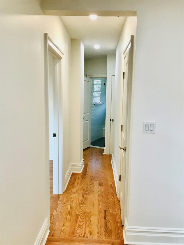 hallway featuring light hardwood / wood-style flooring