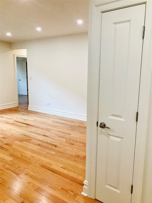 unfurnished room with light hardwood / wood-style flooring