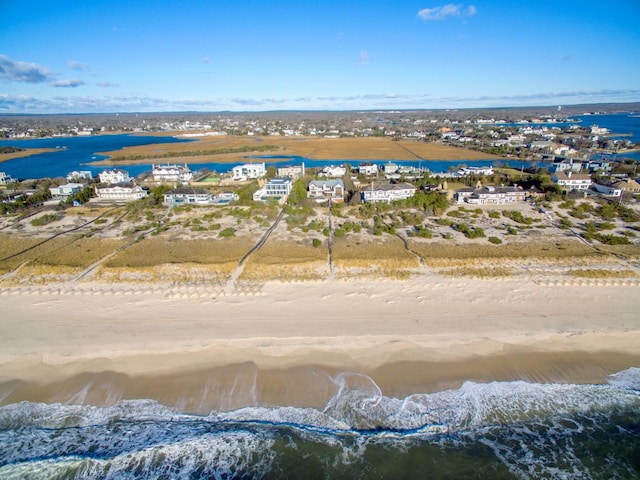 bird's eye view with a water view and a view of the beach